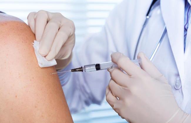 Doctor vaccinates person (Source: Alesandro Guerriero / shutterstock.com)
